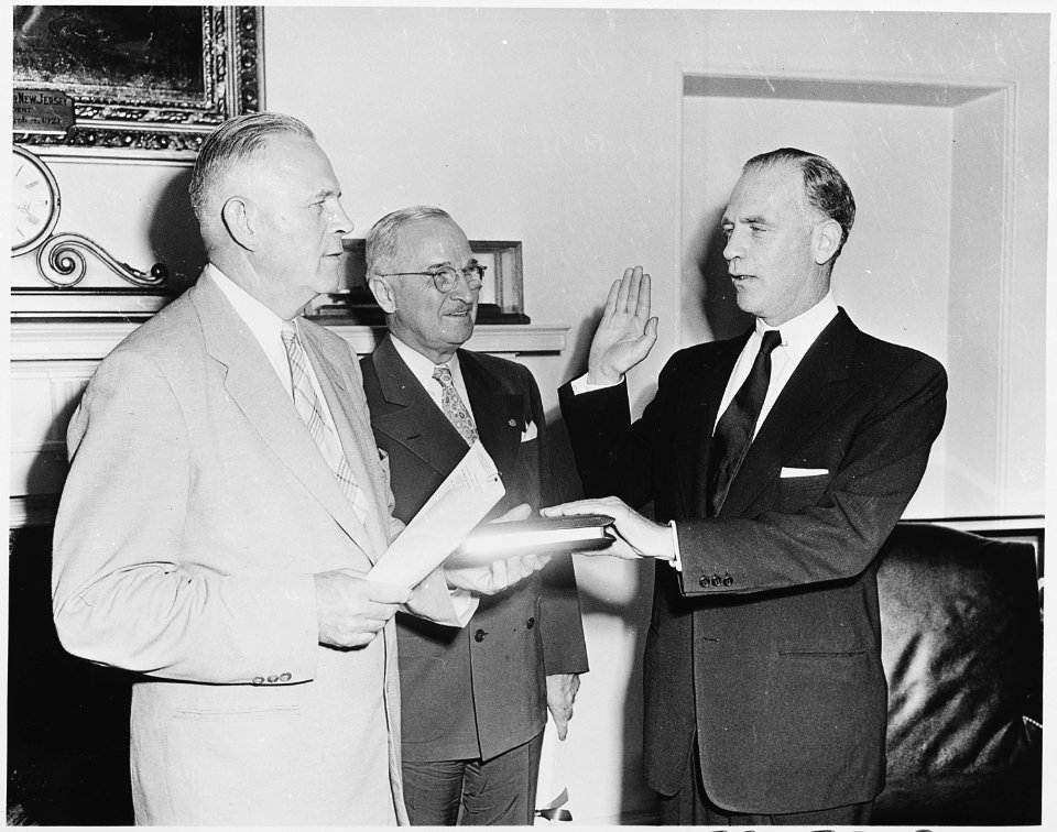 Photograph of Gordon Gray taking the oath of office as Director of the Psychological Strategy Board in the Oval... - NARA - 200329