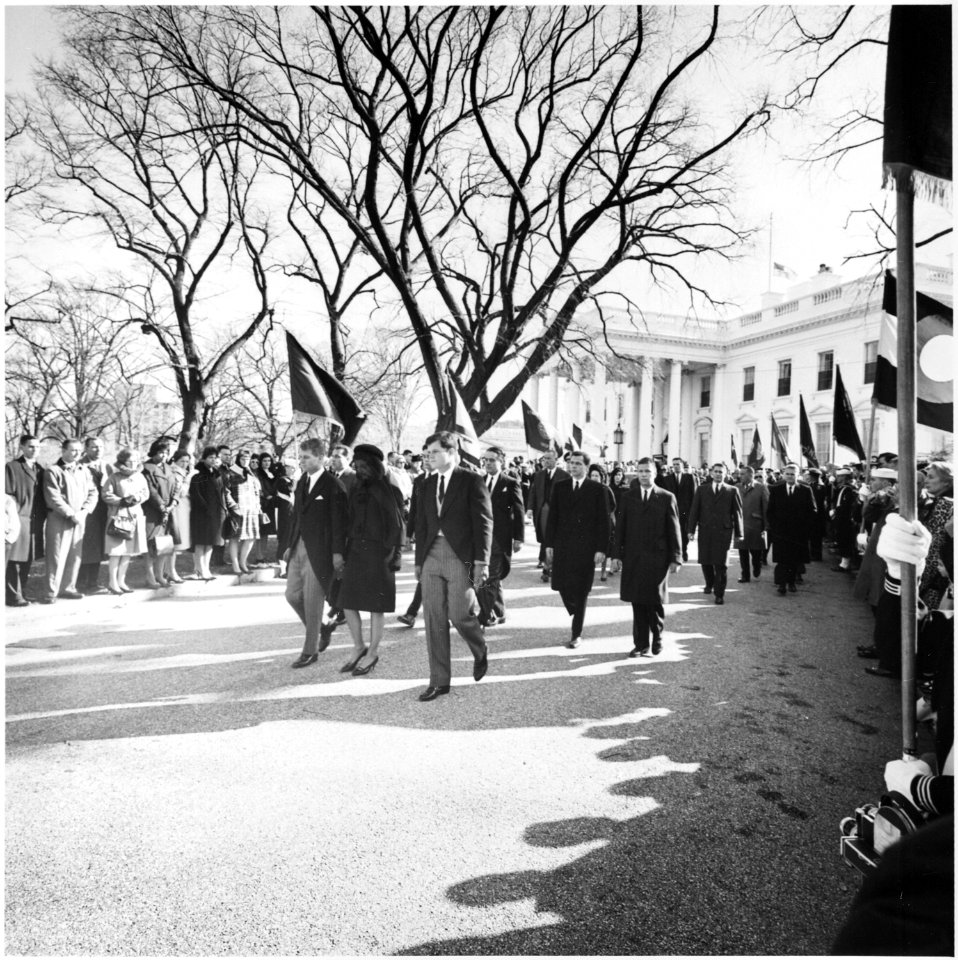 Photograph of Jacqueline Kennedy, accompanied by her brothers-in-law, Attorney General Robert F. Kennedy and Senator... - NARA - 200454
