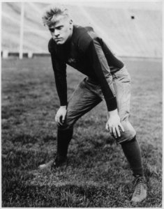 Photograph of Gerald R. Ford, Jr., on the Field of Michigan Stadium at the University of Michigan, Ann Arbor, Michigan - NARA - 186975