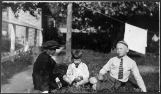 Photograph of Gerald R. Ford, Jr., Sitting on the Lawn with Half-Brother Thomas Tom Ford (Center) and Cousin... - NARA - 186936 photo