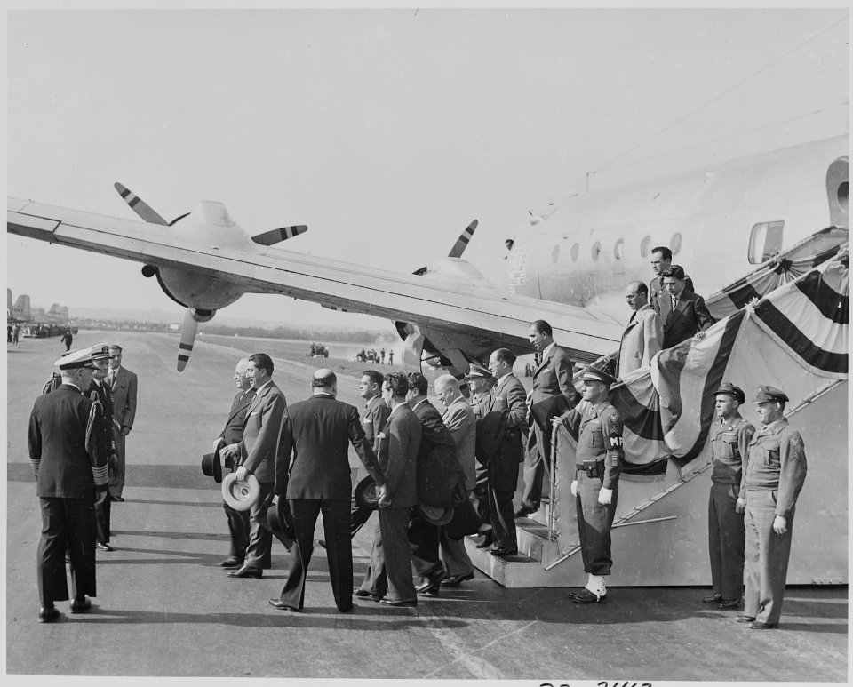 Photograph of Mexican President Miguel Aleman walking from his airplane at Washington's National Airport, accompanied... - NARA - 199572