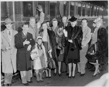 Photograph of movie stars arriving in Washington to participate in Roosevelt Birthday Ball activities at the White... - NARA - 199312