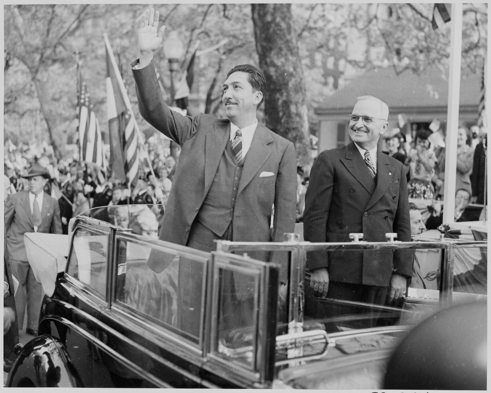 Photograph of Mexican President Miguel Aleman waving to the crowd during a welcoming ceremony at the District... - NARA - 199555