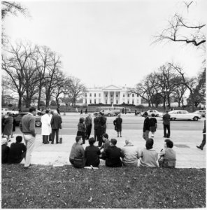 Photograph of people gathered across the street from the White House, during the weekend of President Kennedy's funeral. - NARA - 200449