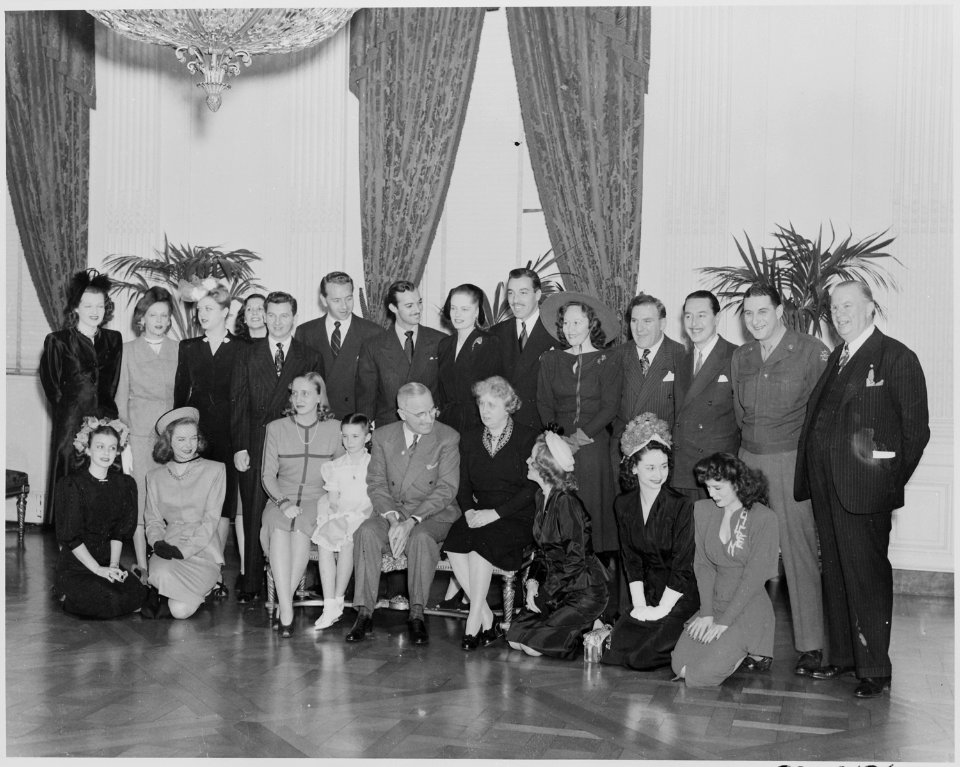 Photograph of movie stars posing with President Truman and his family at the White House. - NARA - 199331