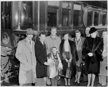 Photograph of movie stars arriving in Washington to participate in Roosevelt Birthday Ball activities, (from left to... - NARA - 199344