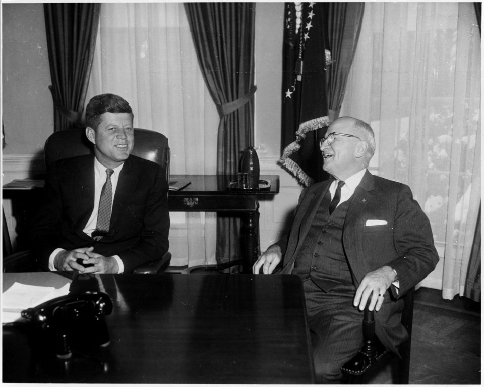 Photograph of President John F. Kennedy conferring with former President Harry S. Truman in the Oval Office, on... - NARA - 200437