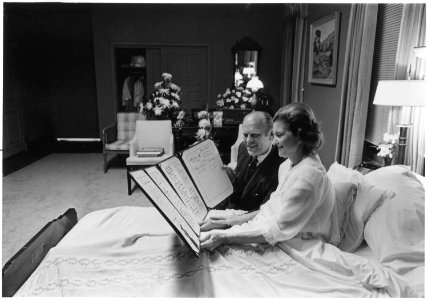 Photograph of President Gerald Ford and First Lady Betty Ford Reading a Petition, Signed by All 100 Members of the... - NARA - 186773