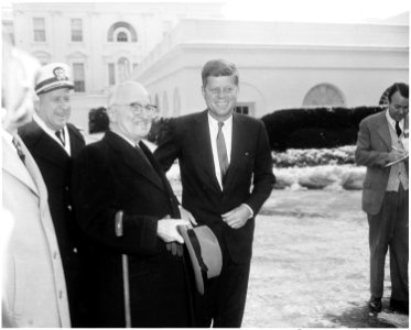 Photograph of President John F. Kennedy, on his first full day in office, greeting former President Harry S. Truman... - NARA - 200436