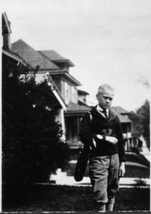 Photograph of Gerald R. Ford, Jr., in Golf Attire, Standing in Front of His Grand Rapids, Michigan Home - NARA - 186959 photo