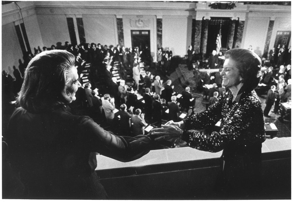 Photograph of First Lady Betty Ford Congratulating Happy Rockefeller Following the Swearing-In of Nelson A.... - NARA - 186786