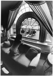 Photograph of First Lady Betty Ford Looking Out a Window, on the Second Floor of the White House, Towards the Oval... - NARA - 186789 photo