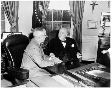 Photograph of President Truman and British Prime Minister Winston Churchill conferring in the Oval Office, during... - NARA - 200349