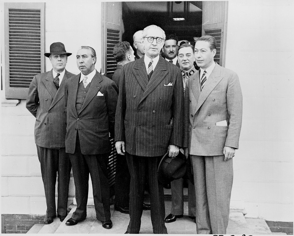 Photograph of President Juan Antonio Rios of Chile with other dignitaries, standing in the doorway of George... - NARA - 199237