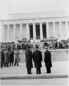Photograph of President Truman (center) and other dignitaries watching as a wreath is carried up the steps of the... - NARA - 200082