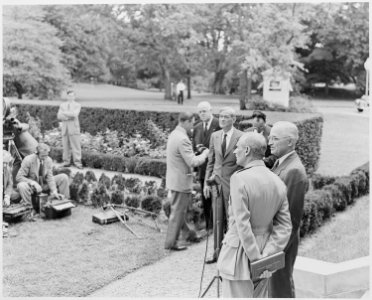 Photograph of President Truman and and Field Marshal Montgomery standing before a microphone on the White House lawn. - NARA - 199426