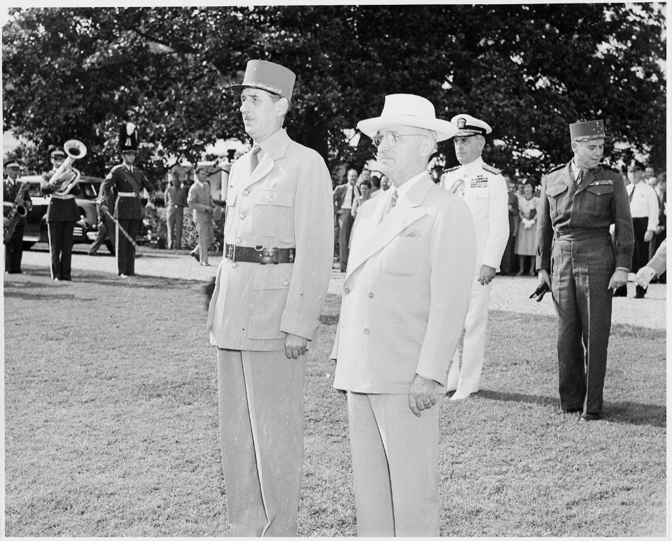 Photograph of President Truman and French President Charles de Gaulle, standing at attention during welcoming... - NARA - 199187