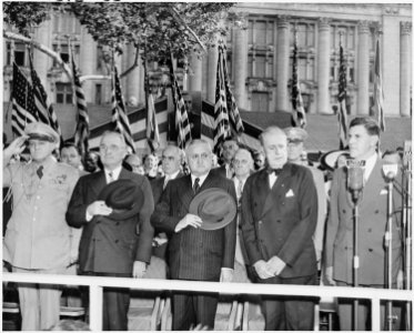 Photograph of President Truman and Brazilian President Eurico Dutra standing at attention with other dignitaries... - NARA - 200121 photo