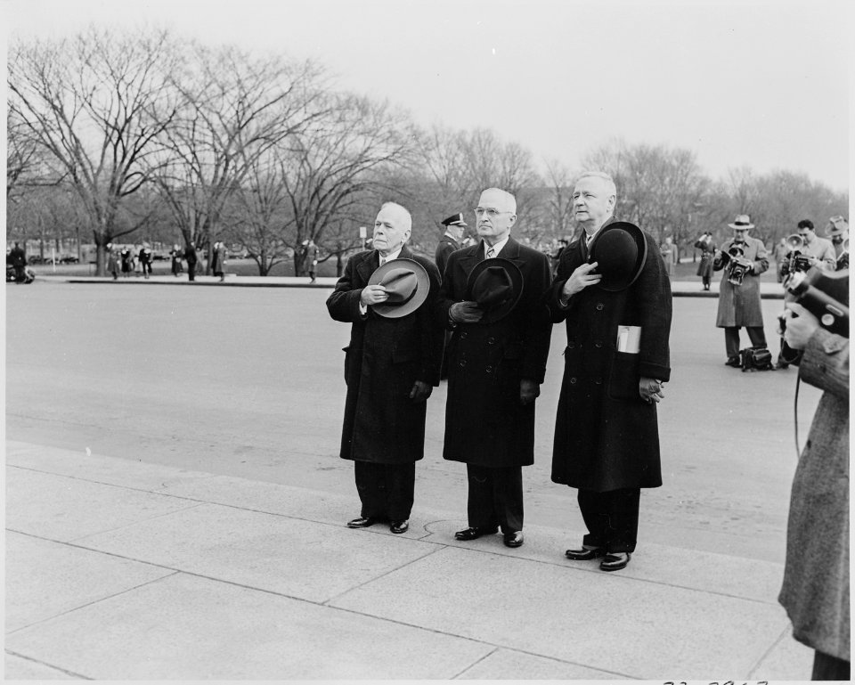 Photograph of President Truman and other dignitaries standing at attention outside the Lincoln Memorial during... - NARA - 200081