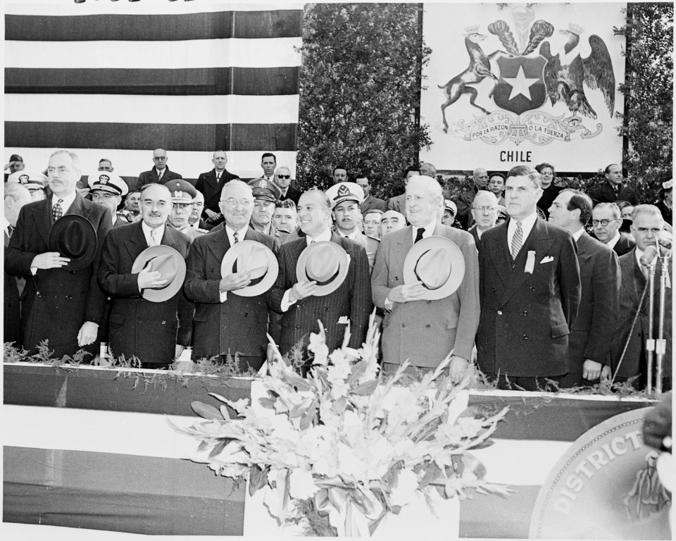 Photograph of President Truman and President Gabriel Gonzalez Videla of Chile standing at attention with other... - NARA - 200206