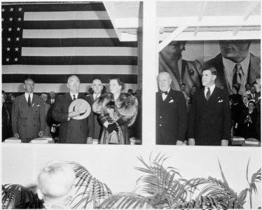 Photograph of President Truman and Queen Juliana of the Netherlands standing at attention during welcoming ceremonies... - NARA - 200374 photo