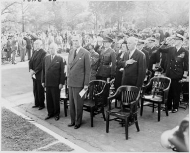 Photograph of President Truman and other dignitaries standing at attention during ceremonies at Arlington National... - NARA - 200241