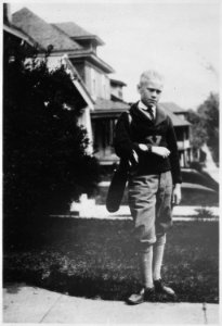 Photograph of Gerald R. Ford, Jr., in Golf Attire, Standing in Front of his Grand Rapids, Michigan Home - NARA - 186893