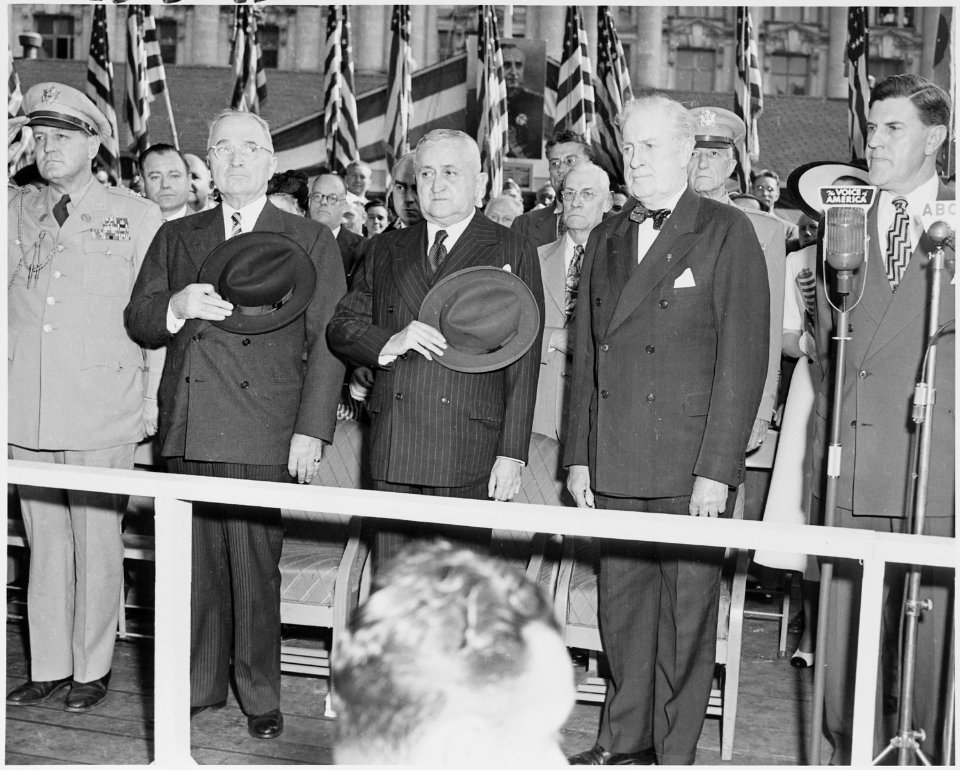 Photograph of President Truman and President Eurico Dutra of Brazil, standing at attention during ceremonies... - NARA - 200127