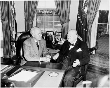 Photograph of President Truman conferring with the Prime Minister of Great Britain, Winston Churchill, in the Oval... - NARA - 200350 photo
