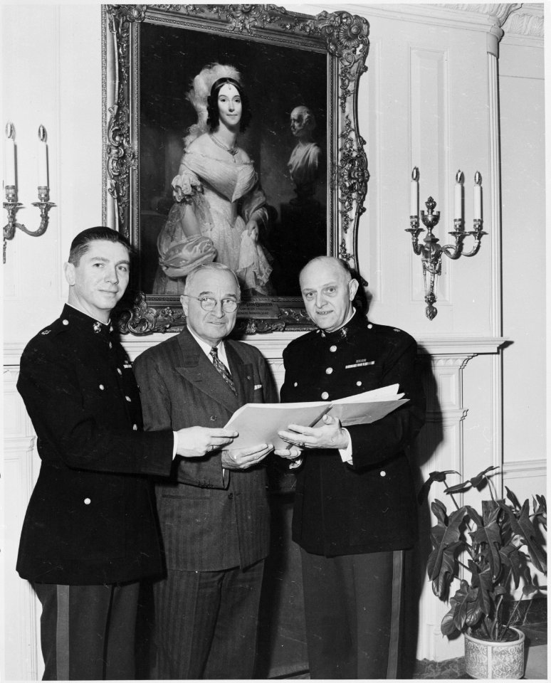 Photograph of President Truman at the White House with two members of the U.S. Marine Corps band. - NARA - 200409