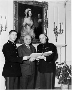Photograph of President Truman at the White House with two members of the U.S. Marine Corps band. - NARA - 200409