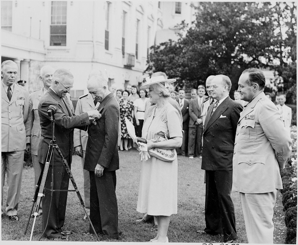 Photograph of President Truman awarding Secretary of State Byrnes the Distinguished Service Medal in the Rose Garden... - NARA - 199182