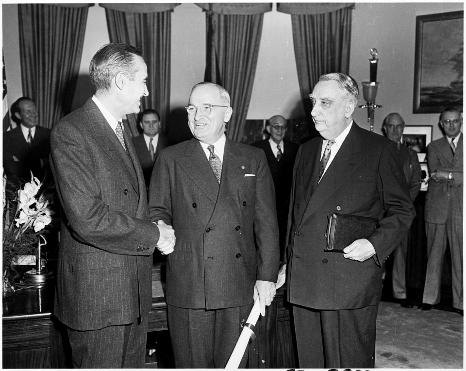Photograph of President Truman in the Oval Office shaking hands with W. Averell Harriman, the new Director of the... - NARA - 200362
