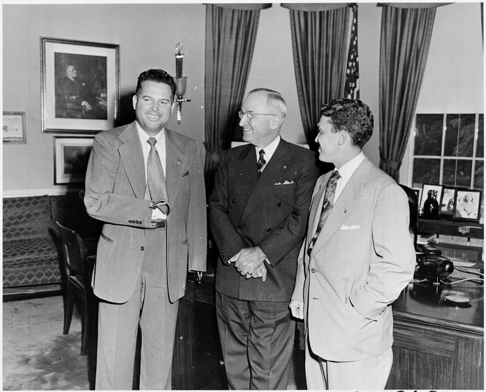Photograph of President Truman in the Oval Office with two members of the Amputee Demonstration Team of the American... - NARA - 200307