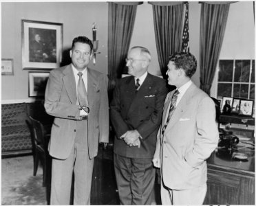 Photograph of President Truman in the Oval Office with two members of the Amputee Demonstration Team of the American... - NARA - 200307