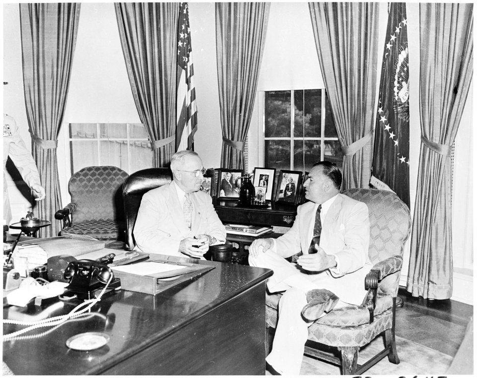 Photograph of President Truman conferring with Ecuadoran President Galo Plaza in the Oval Office. - NARA - 200305