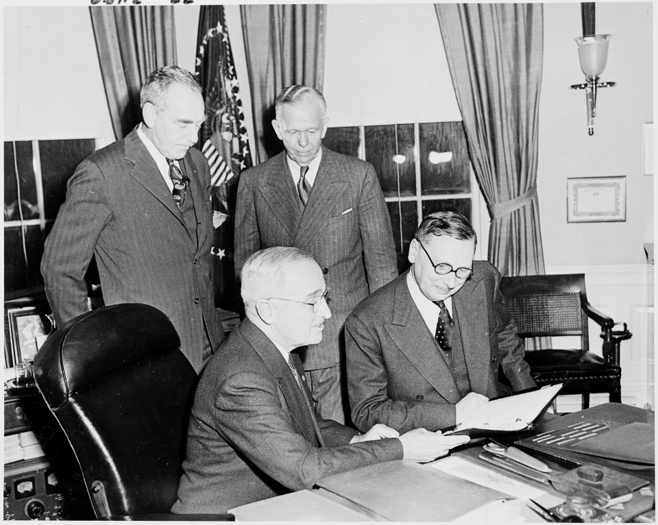 Photograph of President Truman in the Oval Office with the Prime Minister of France, Rene Pleven, as Secretary of... - NARA - 200264