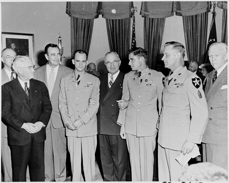 Photograph of President Truman in the Oval Office after presenting three Korean War veterans with the Medal of Honor... - NARA - 200295