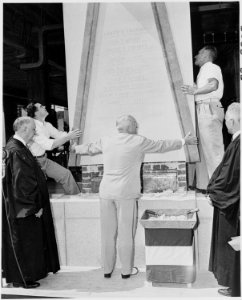 Photograph of President Truman helping to guide the laying of the cornerstone for the new U.S. Courthouse for the... - NARA - 200214 photo