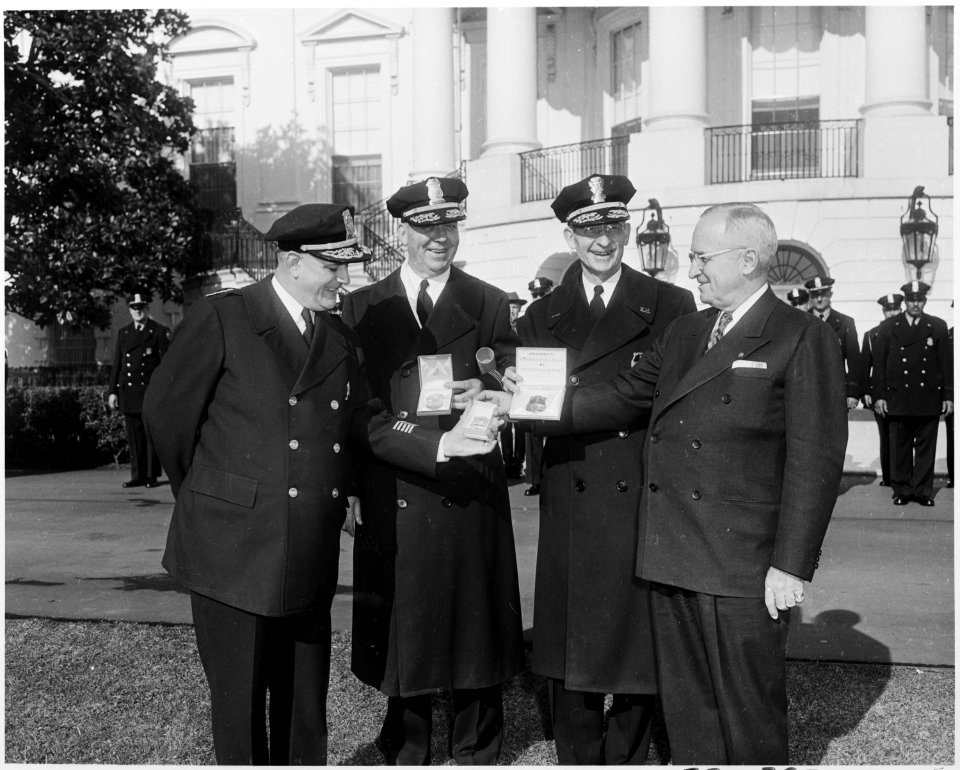 Photograph of President Truman on the White House grounds receiving honorary bades from the Washington Metropolitan... - NARA - 200415