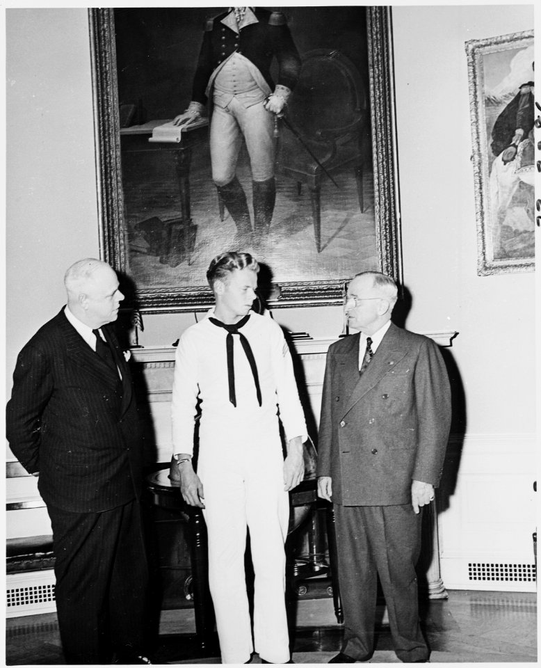 Photograph of President Truman in the Oval Office with White House receptionist William Simmons and Bob Simmons. - NARA - 200199