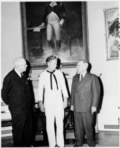 Photograph of President Truman in the Oval Office with White House receptionist William Simmons and Bob Simmons. - NARA - 200199