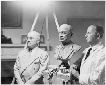 Photograph of President Truman posing in the Cabinet Room of the White House for sculptor Nison Tregor, who is... - NARA - 200389