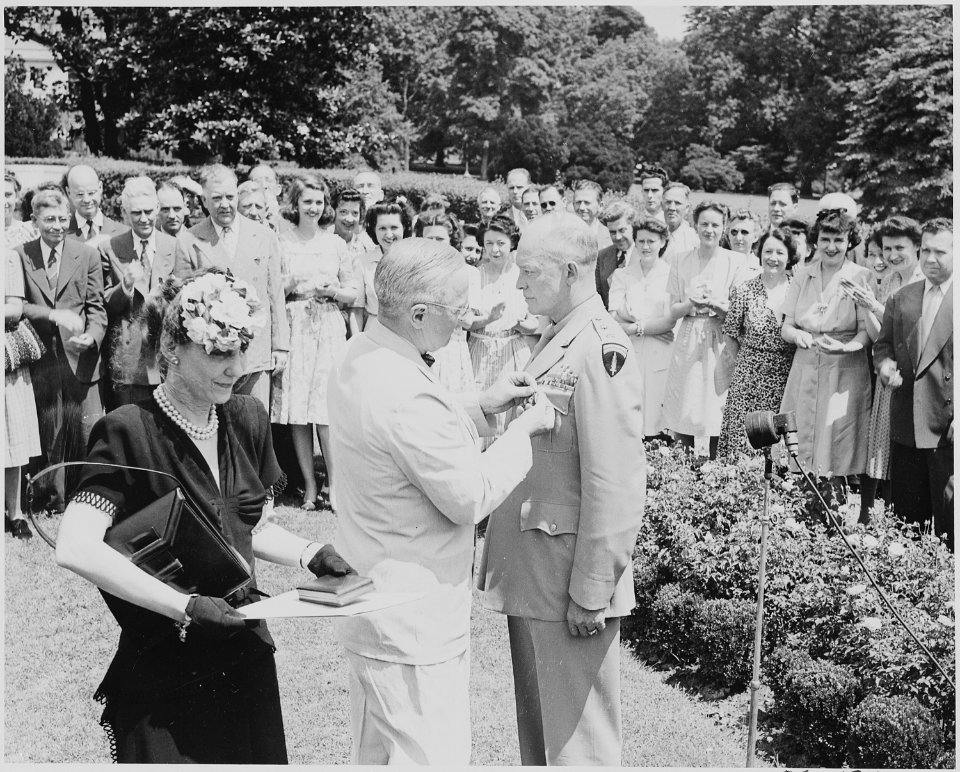 Photograph of President Truman pinning the Distinguished Service Medal on General Dwight D. Eisenhower, before a... - NARA - 199118