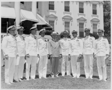 Photograph of President Truman posing on the White House lawn with officers from eight U.S. Navy aircraft carriers... - NARA - 199399