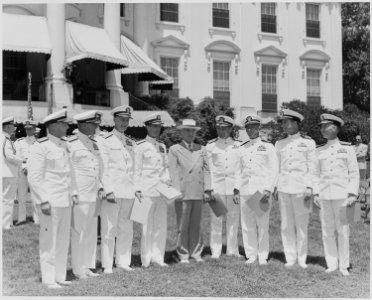 Photograph of President Truman posing on the White House lawn with officers from eight U.S. Navy aircraft carriers... - NARA - 199404