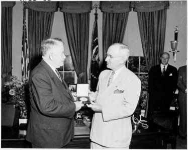 Photograph of President Truman presenting a Gold Medal authorized by Congress to Vice President Alben Barkley, in the... - NARA - 200219