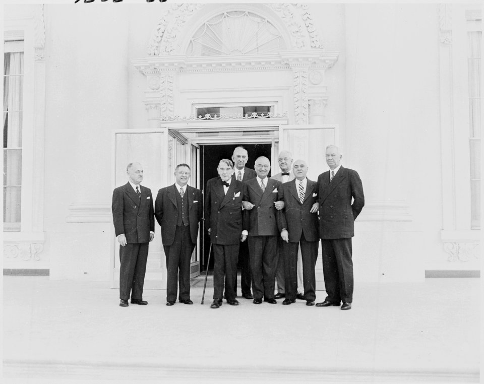 Photograph of President Truman posing outside the renovated White House with officials of the Commission on the... - NARA - 200194