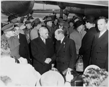 Photograph of President Truman shaking hands with British Prime Minister Clement Attlee at Washington National... - NARA - 200256