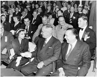 Photograph of President Truman shaking hands with an unidentified woman at the dedication of the Carter Barron... - NARA - 200310